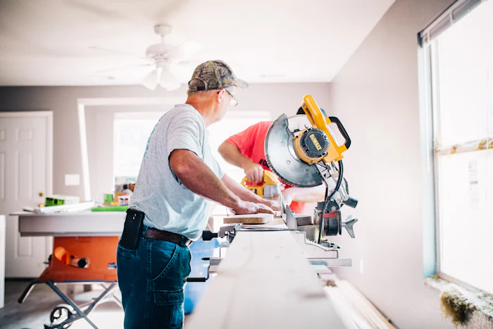 Handyman using a miter saw for home repair services in Treasure Valley